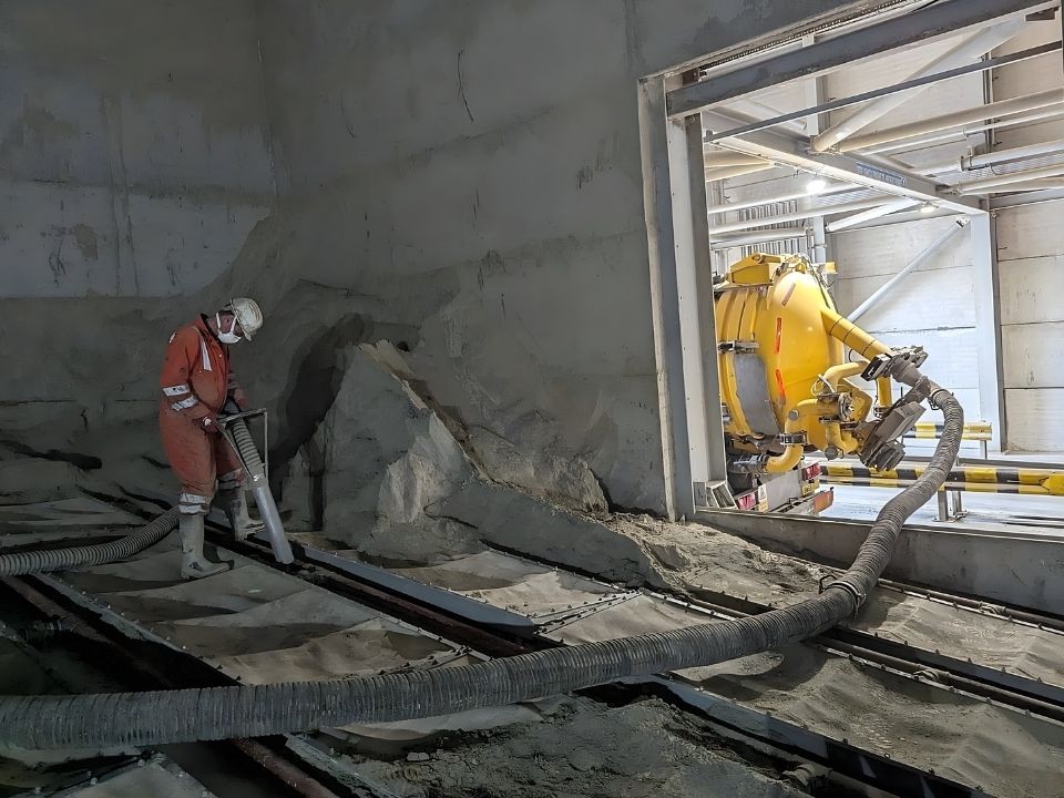 NQIS team members using the vacuum tanker extension