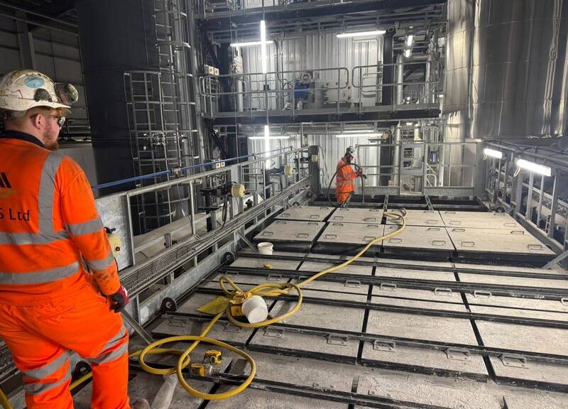 NQIS operatives carrying out planned industrial cleaning and maintenance work inside an industrial processing plant